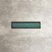Alchemy Hunter Green 6.5×30cm ceramic wall tile with a glossy green finish.