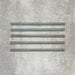 Allegra Celadon Green Gloss pencil bullnose border ceramic tiles in a 1.2 × 30cm format, shown as a set to highlight the soft green tones, glossy finish, smooth rounded edges and subtle handmade-style variation for decorative borders and trims.