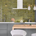 Kitchen splashback featuring Allegra Daisy Green Gloss Brick ceramic tiles in a 6 × 25cm format, creating a vibrant, contemporary look with rich green tones, a glossy finish and subtle handmade-style variation.