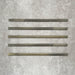 Five Allegra Daisy Green Gloss pencil bullnose border ceramic tiles in a 1.2 × 30cm format, laid horizontally to showcase the slim profile, glossy finish and subtle natural green tonal variations across the set.