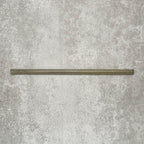 Single Allegra Daisy Green Gloss pencil bullnose border ceramic tile in a 1.2 × 30cm format, shown horizontally to highlight the slim profile, glossy glaze and natural green tonal variation.
