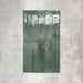 Allegra Green Gloss pencil bullnose border tiles in a 1.2 × 30cm ceramic format, shown arranged with matching brick tiles to highlight the coordinating deep green colour, subtle tonal variation and smooth gloss finish against a neutral textured background.