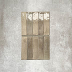 Allegra Sage Green Gloss pencil bullnose border ceramic tiles in a 1.2 × 30cm format, shown laid vertically to highlight the muted green tones, glossy finish and subtle handmade-style variation, ideal for edging and decorative borders.