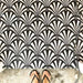 Floor featuring Almeria Casablanca Moroccan-style porcelain tiles in a bold black and white fan pattern, 20x20cm, creating a striking and decorative tiled surface.