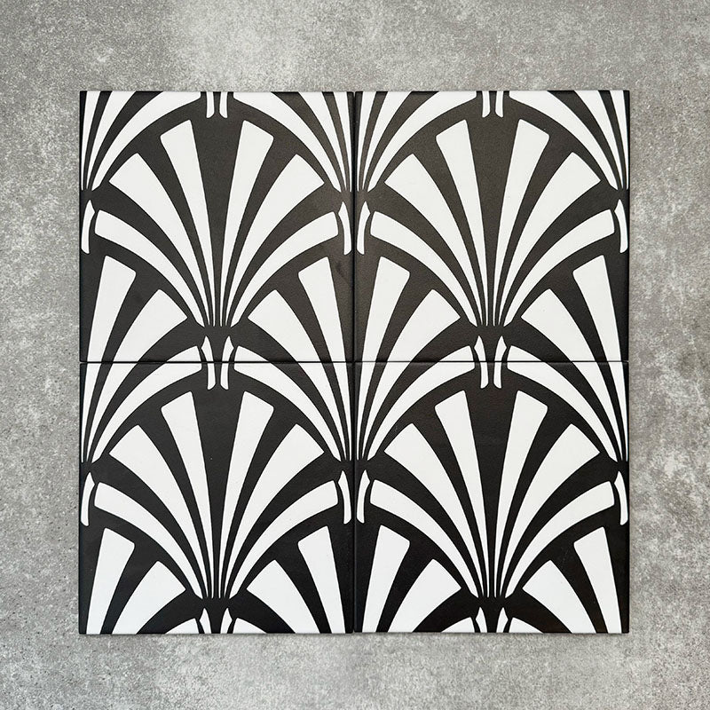 Four Almeria Casablanca Moroccan-style porcelain wall and floor tiles displayed together in a bold black and white fan pattern, 20x20cm.