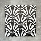 Four Almeria Casablanca Moroccan-style porcelain wall and floor tiles displayed together in a bold black and white fan pattern, 20x20cm.