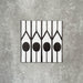 Single Almeria Felis Moroccan-style porcelain tile featuring a black and white geometric dot and line pattern, 20x20cm, suitable for wall and floor use.