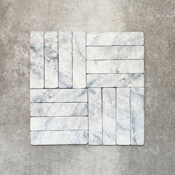 Product image of Amalfi Brick Azul Vintage Marble wall and floor tiles in a 5.4cm x 22cm format, arranged in a basketweave pattern, showcasing soft blue and white marble effect detailing with subtle veining and tonal variation.