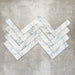 Product image of Amalfi Brick Azul Vintage Marble wall and floor tiles in a 5.4cm x 22cm format, arranged in a herringbone pattern, showcasing soft blue and white marble effect detailing with subtle veining and tonal variation.