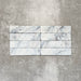 Product image of Amalfi Brick Azul Vintage Marble wall and floor tiles in a 5.4cm x 22cm format, showcasing soft blue and white marble effect detailing with subtle veining and tonal variation.