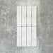 Product image of Amalfi Brick Carrara Vintage Marble wall and floor tiles in a 5.4cm x 22cm format, showcasing a soft white marble effect surface with subtle tonal variation.