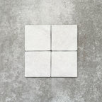 Product image of Amalfi Square Carrara Vintage Marble wall and floor tiles in an 11cm x 11cm format, featuring a soft white marble effect surface with subtle tonal variation and gently rounded edges.