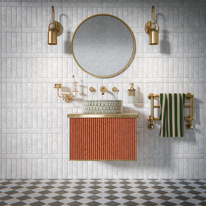 Bathroom featuring Amalfi Square Carrara Vintage Marble 11x11cm wall and floor tiles, laid in a diagonal chequerboard pattern, showcasing soft white and grey tones, paired with brass fittings, a fluted vanity unit, and a classic contemporary finish.