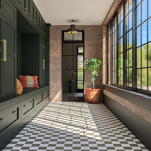 Hallway featuring Amalfi Carrara Square 11cm x 11cm vintage marble wall and floor tiles in a chequerboard design, paired with dark green cabinetry, exposed brick walls and black-framed windows.