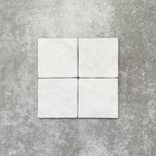 Product image of Amalfi Square Carrara Vintage Marble wall and floor tiles in an 11cm x 11cm format, featuring a soft white marble effect surface with subtle tonal variation and gently rounded edges.