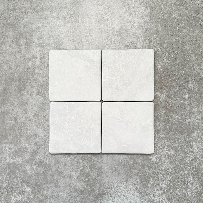 Product image of Amalfi Square Carrara Vintage Marble wall and floor tiles in an 11cm x 11cm format, featuring a soft white marble effect surface with subtle tonal variation and gently rounded edges.
