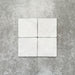 Product image of Amalfi Square Carrara Vintage Marble wall and floor tiles in an 11cm x 11cm format, featuring a soft white marble effect surface with subtle tonal variation and gently rounded edges.