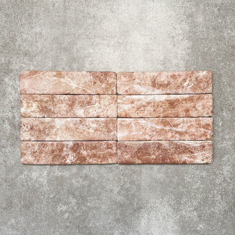 Product image of Amalfi Brick Rouge Vintage Marble wall and floor tiles in a 5.4cm x 22cm format, showcasing warm blush pink marble effect detailing and natural tonal variation.