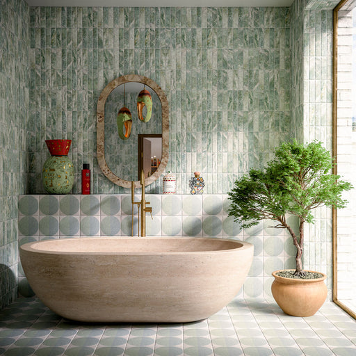 Bathroom featuring Amalfi Brick Salvia Vintage Marble 5.4x22cm wall and floor tiles, styled with a freestanding stone bath, green patterned floor tiles, brushed brass fixtures and botanical-inspired contemporary décor.