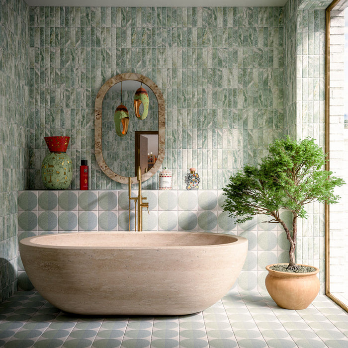 Bathroom featuring Amalfi Brick Salvia Vintage Marble 5.4x22cm wall and floor tiles, styled with a freestanding stone bath, green patterned floor tiles, brushed brass fixtures and botanical-inspired contemporary décor.