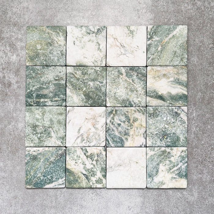 Product image of Amalfi Square Salvia Vintage Marble wall and floor tiles in an 11cm x 11cm format, featuring green and white marble effect detailing, natural veining and softly rounded vintage-inspired edges.