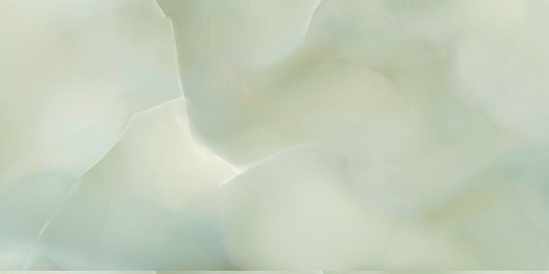 Close-up of Anastasia Jade Green Onyx Polished 60 × 120cm stone effect tile, featuring soft green tones with flowing gold and amber veining, creating a layered, organic pattern with a high-gloss polished finish.