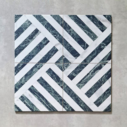Flat lay of Art Deco Emerald Green marble effect patterned porcelain tiles 44 × 44cm, arranged to showcase the repeating geometric design. The combination of deep emerald marble effect lines and crisp white segments creates a structured, interlocking pattern with strong visual movement and contrast.