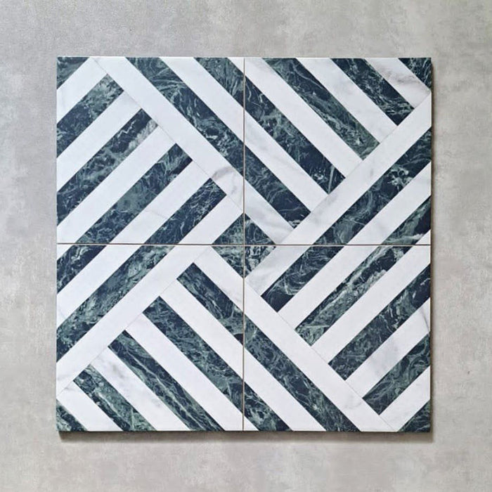 Flat lay of Art Deco Emerald Green marble effect patterned porcelain tiles 44 × 44cm, arranged to showcase the repeating geometric design. The combination of deep emerald marble effect lines and crisp white segments creates a structured, interlocking pattern with strong visual movement and contrast.