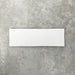 Close-up of Foundry Bricks Arctic White 6.5x20cm brick wall tile, showcasing clean white tones with a smooth, lightly textured surface and gently irregular edges, highlighting a refined, contemporary finish.