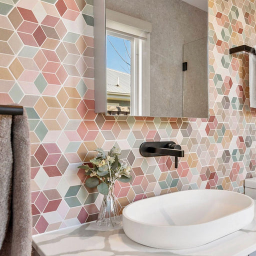 Bathroom vanity featuring Athens Multicoloured Hexagon Patchwork 17 × 15cm Moroccan-style wall tiles, creating a colourful geometric backdrop, paired with a modern countertop basin, matte black tapware and soft neutral accessories.
