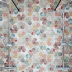 Shower wall featuring Athens Multicoloured Hexagon Patchwork 17x15cm Moroccan-style tiles, showcasing a geometric hexagon pattern in soft pastel and earthy tones for a vibrant yet balanced bathroom feature.
