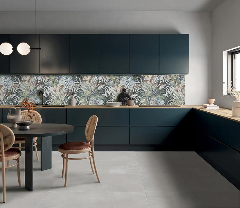 Kitchen featuring Bahamas 60 × 120cm wall and floor tiles, used as a striking tropical-style splashback with layered botanical detail. Paired with deep cabinetry and wood worktops for a balanced, design-led finish.