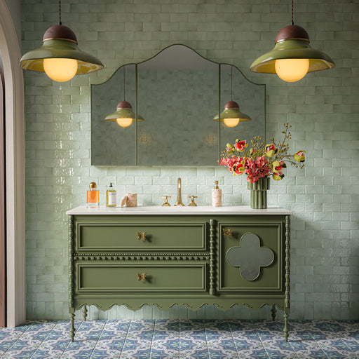 Bathroom featuring Balthazar Blue 20cm x 20cm Victorian Moroccan-style floor tiles, paired with Liberty Mint Green gloss wall tiles, a sage green vanity unit, brass fittings and decorative lighting.