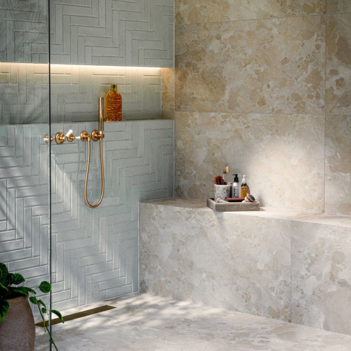 Bathroom featuring Baresi Cream 3D Terrazzo Effect 60x120cm porcelain tiles, showcasing a warm cream terrazzo effect design with subtle texture, paired with sage green feature wall tiles, brass fittings and a contemporary walk-in shower.