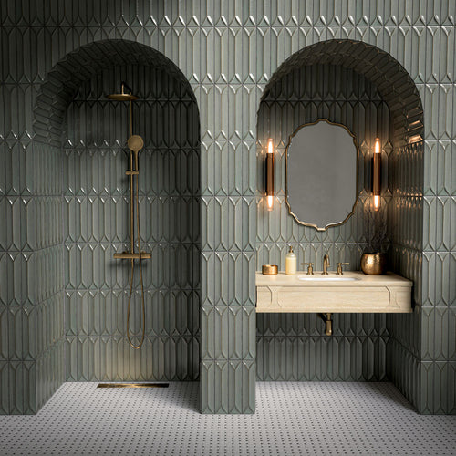 Bathroom vanity area featuring Baroque Decor Lichen Green 9.1x37.5cm porcelain wall tiles, showcasing a glossy fluted design in soft green tones, paired with a stone basin, brass fittings and warm ambient lighting.