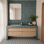 Bathroom featuring Baroque Laguna Blue 9.1cm x 37.5cm porcelain wall tiles around a wooden vanity, paired with matching geometric décor tiles, patterned flooring and neutral walls.