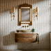 Interior featuring Baroque Decor Vanilla porcelain wall tiles, creating a luxurious statement wall with an elegant geometric relief pattern. The soft vanilla tones and subtle texture add depth and movement while maintaining a calm, neutral palette. Paired with rich walnut furniture, marble accents and antique brass details, the space balances contemporary design with classic sophistication. The decorative surface catches the light beautifully, bringing warmth, texture and a refined architectural feel to the