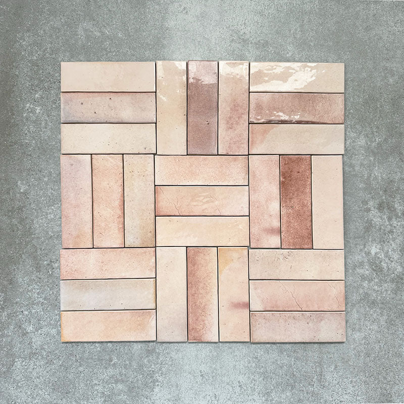Saigon Rose Pink Brick Wall tiles arranged in a basketweave pattern, featuring Moroccan-style 5.1 × 16.1cm glossy ceramic tiles in soft blush and rose tones with natural colour variation.