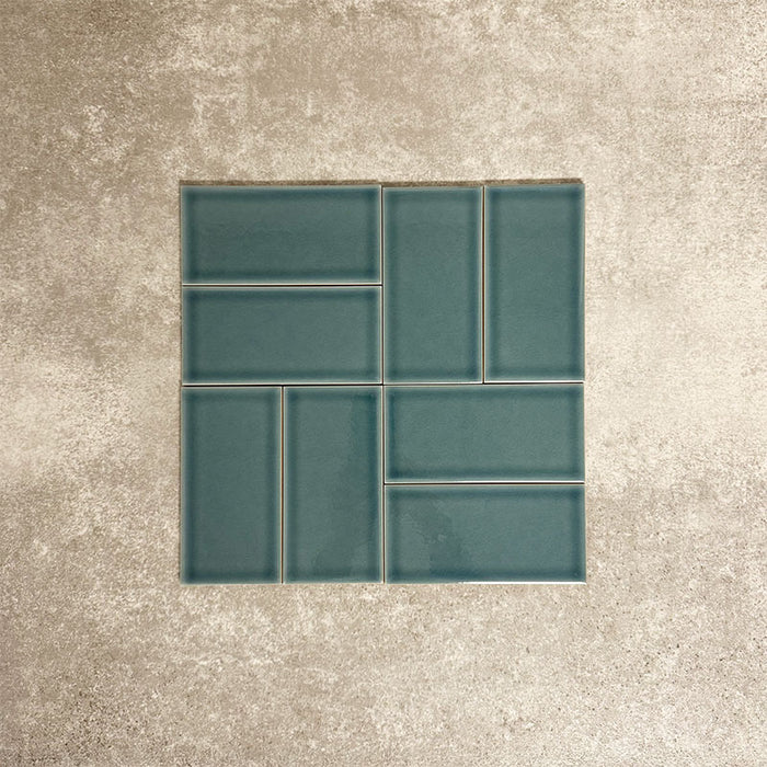 Pimlico River Blue 7.5 × 15cm ceramic wall tiles with a crackle glaze finish, shown in a basketweave layout that highlights deep blue tones, subtle texture and versatile design options for kitchens and bathrooms.