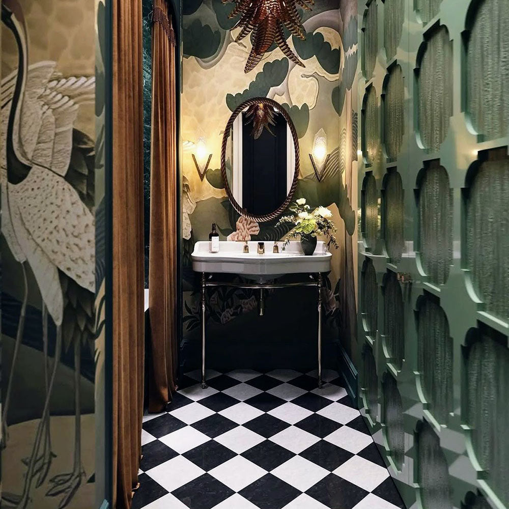 Bathroom setting featuring Manor Plain White Base 20x20cm tiles paired with contrasting black tiles in a classic chequerboard layout, creating a bold geometric floor, styled with rich wall tones and brass accents for a striking, timeless finish.