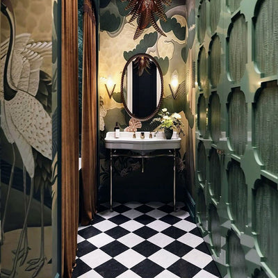 Bathroom setting featuring Manor Plain White Base 20x20cm tiles paired with contrasting black tiles in a classic chequerboard layout, creating a bold geometric floor, styled with rich wall tones and brass accents for a striking, timeless finish.
