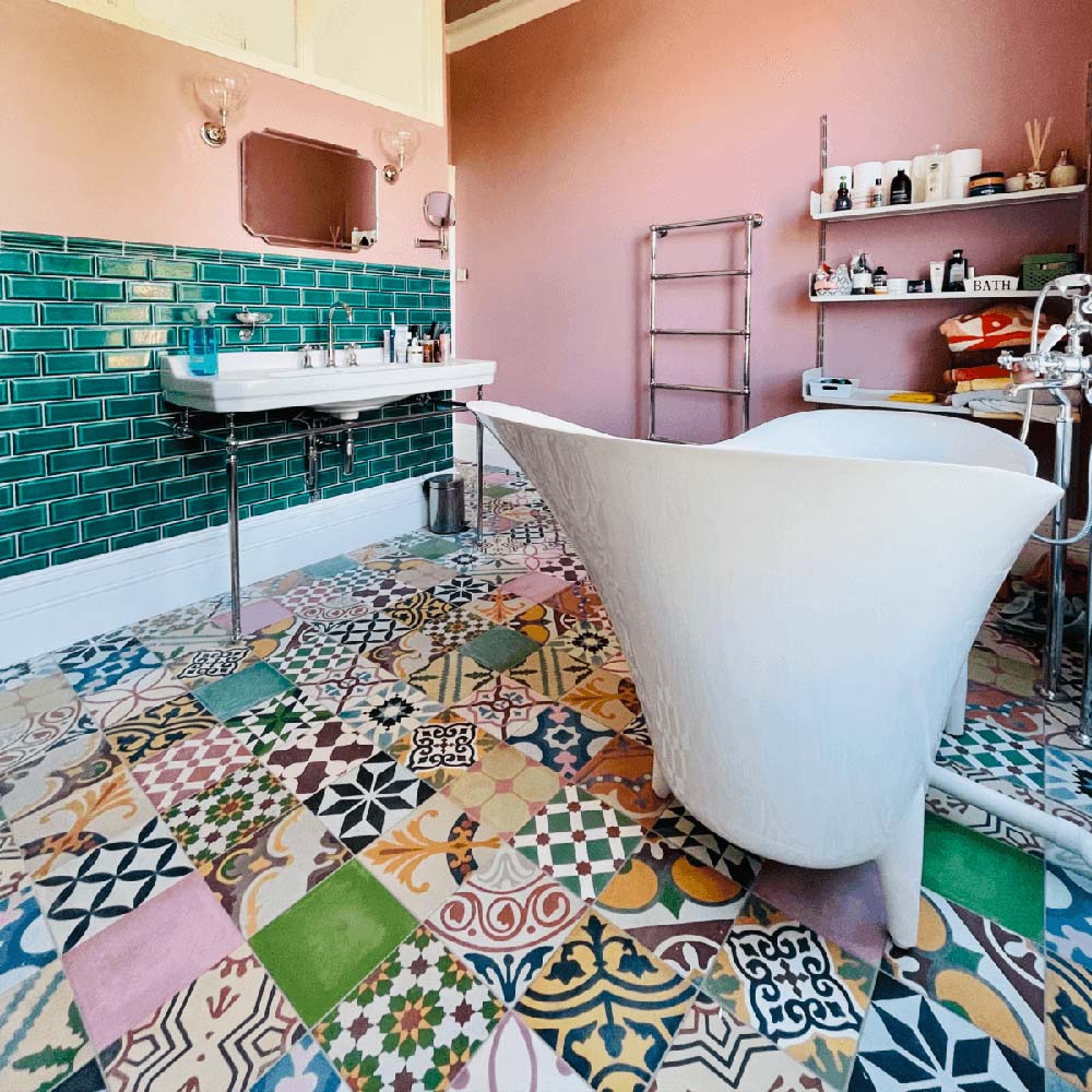 Bathroom interior featuring Fayrouz Patchwork 20×20cm Moroccan-style porcelain floor tiles, combining colourful geometric and floral patterns for a bold, decorative patchwork effect.