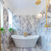 Bathroom interior featuring Fayrouz Lilac 30.5x61cm natural marble tiles with a honed finish, installed across the walls and floor to showcase a white base with soft lilac and grey veining, creating an elegant, spa-like setting with refined natural variation.