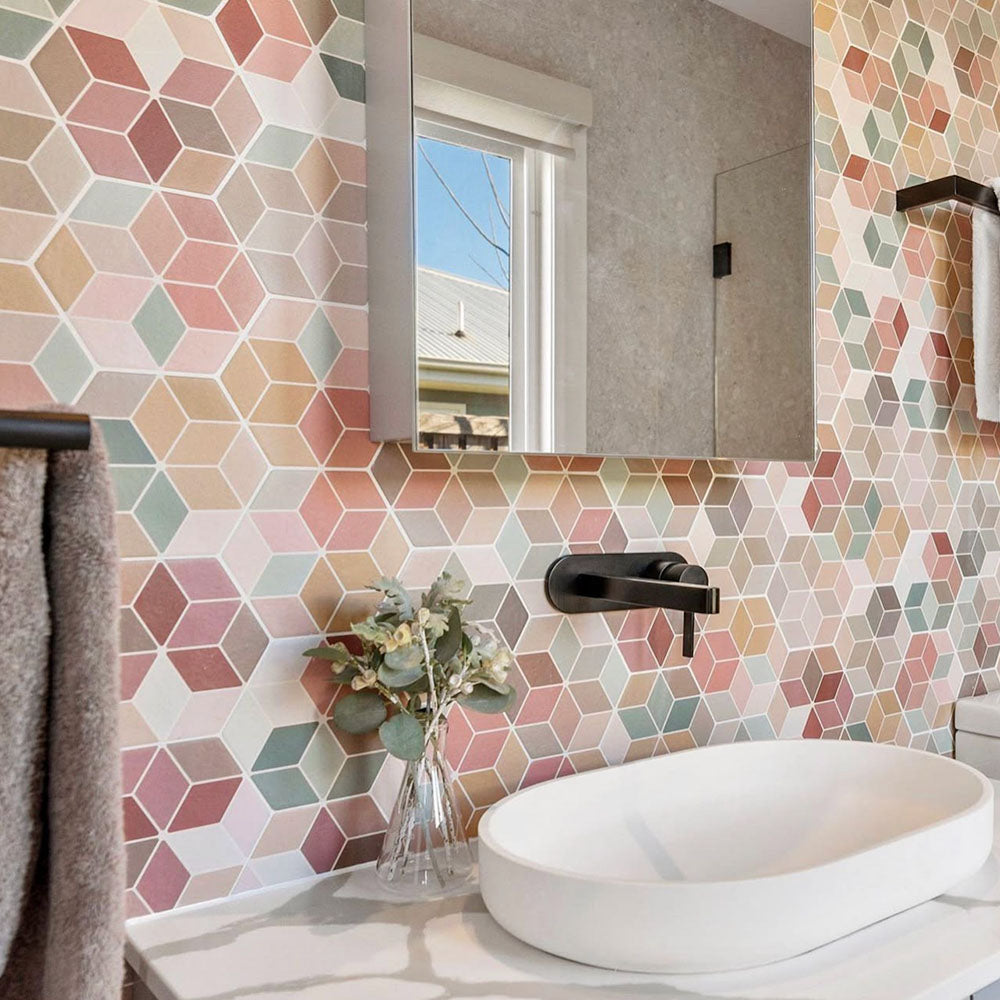 Bathroom vanity featuring Athens Multicoloured Hexagon Patchwork 17 × 15cm Moroccan-style wall tiles, creating a colourful geometric backdrop, paired with a modern countertop basin, matte black tapware and soft neutral accessories.