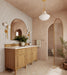 Bathroom setting featuring Benomar White Moroccan-style mini brick tiles in a 5x15cm format, arranged in a vertical layout to introduce a subtle sense of height and rhythm across the walls. The soft white tones and tonal variation create a gently textured surface, while the matt finish keeps the overall look calm and considered.