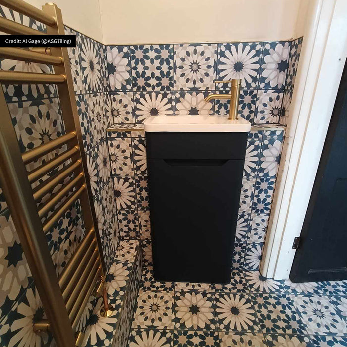 Bathroom featuring Souk Blue D 20×20cm Moroccan-style porcelain wall tiles in a blue, white and grey geometric pattern.