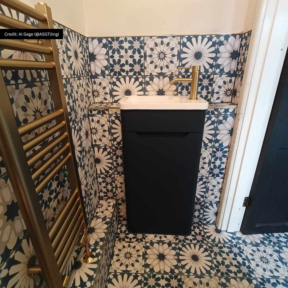 Bathroom featuring Souk Blue  B 20×20cm Moroccan-style porcelain wall tiles in a blue, white and grey geometric pattern.