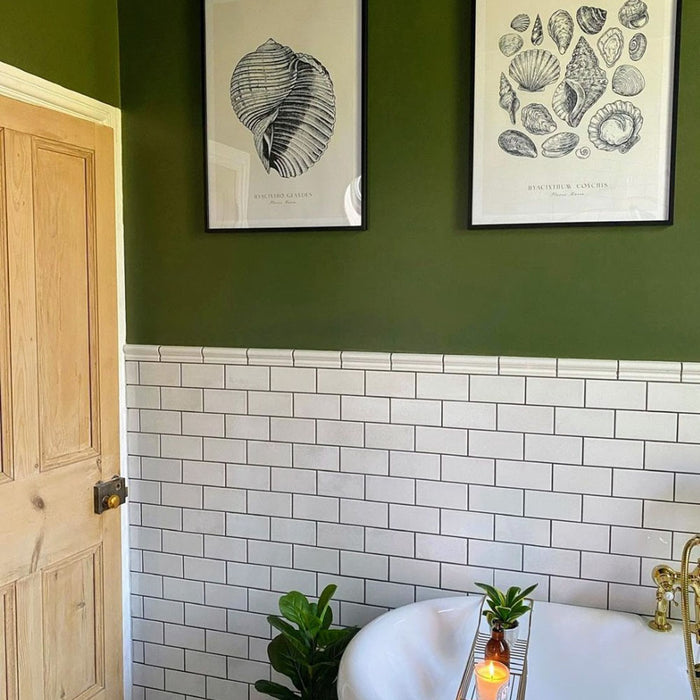 Bathroom featuring Pimlico White 7.5 × 15cm ceramic wall tiles with a crackle glaze finish, laid in a classic brick pattern and paired with a dark vanity, brass fittings and green walls.
