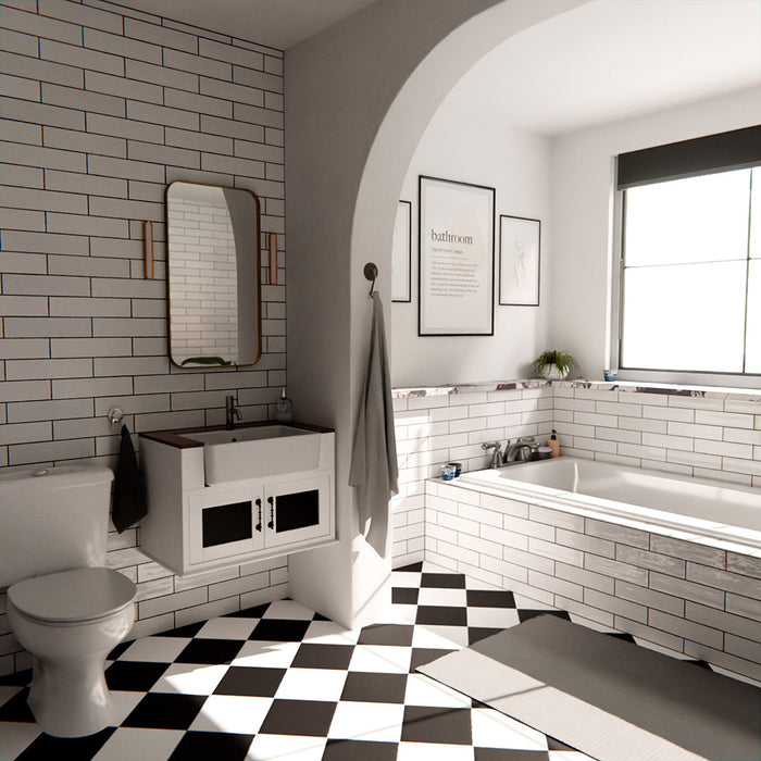 Nairobi gloss white handmade-effect tiles styled in a bathroom setting, featuring a brick-laid wall design paired with a built-in bath, black and white patterned floor tiles, and soft natural light.
