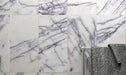 Bathroom wall featuring Fayrouz Lilac 30.5x61cm natural marble tiles with a honed finish, showcasing a soft white base with delicate lilac and grey veining, creating a calm, elegant surface with natural variation and a refined, timeless feel.